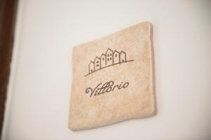 Vottorð, verðlaun, skilti eða annað skjal til sýnis á Dimora Cappuccini Guest House