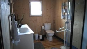 a bathroom with a sink and a toilet at Le grenier in Bazas