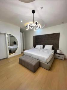 a bedroom with a large bed and a ceiling fan at Paradise View Apartment in Gatunga