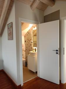 an open door to a bathroom with a sink at ALONI retreat in Proástion +52 photos