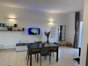 a dining room with a table and chairs at Dreamhouse - The Apartment in Leverano