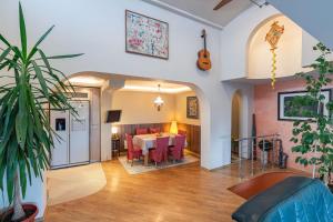 a dining room with a table and red chairs at House 46 in Veliko Tŭrnovo