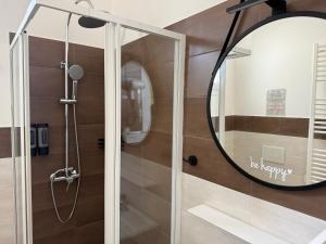 a bathroom with a mirror and a shower at Dreamhouse - The Apartment in Leverano +71 photos