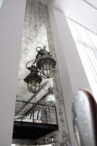 a street light on the side of a building at Chaya Niwas Loft in Żyrardów