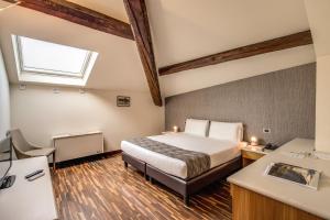 Una cama o camas en una habitación de Albergo Firenze