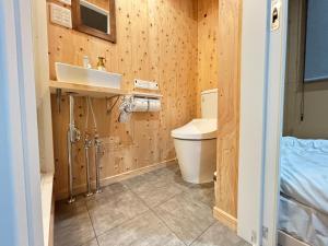 a bathroom with a toilet and a sink at NikkaHotel東郷店 in Togo +27 photos
