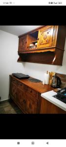 a kitchen with a wooden cabinet and a counter top at U KONC in Stahovica