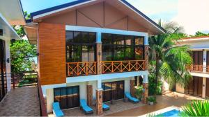 an aerial view of a house with a balcony at The Lei's Hotel and Beach Resort in Mercedes
