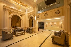 a large living room with couches and a store at Clarks Inn Suites Dhanbad in Dhanbād