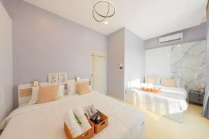 a white bedroom with two beds and a window at Silver Hill Pool Villa Pattaya in Na Jomtien +85 photos