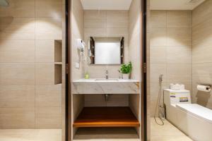 a bathroom with a sink and a mirror at Nesta Home - Old Street in Hanoi +31 photos