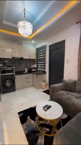 a living room with a couch and a table at Luxury Homes in Lagos +14 photos