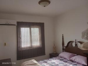 a bedroom with a bed and a window at Royal Chalet Sea View - Stella Di Mare - Families in Az Zafarani +19 photos