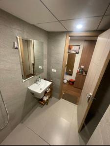 a bathroom with a sink and a mirror at Kervan stays in Greater Noida