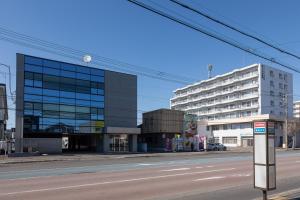 an empty street in front of a large building at HARUSAKU Omachi in Asahikawa