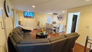 a living room with a couch and a table at Casseus J Legacy in Rosedale