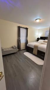 a bedroom with a bed and a window at Casseus J Legacy in Rosedale