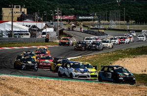a group of cars driving around a race track at Apartman Zlata in Buzdohanj