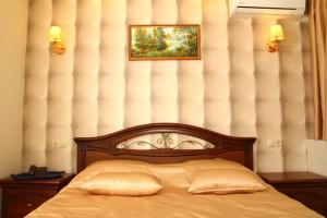 Cama o camas de una habitación en Dukat Hotel on Ibragimova