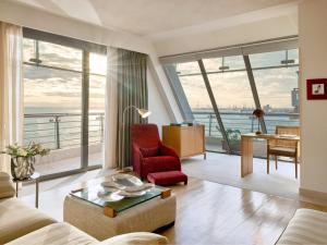 a living room with a view of the ocean at Daios Luxury Living in Thessaloniki