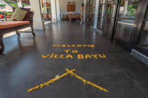 a welcome to villa bar written on the floor of a building at Villa Bayu - exclusive villa with infinity pool, wellness pavilion, panoramic ocean view & full service in Temukus