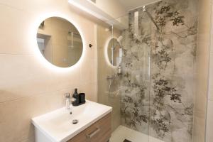 a bathroom with a sink and a shower at Double Room with Breakfast Free Parking and EV ready in Postojna +25 photos