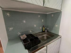 a kitchen with a sink and a counter top with snow flakes at Sandkasteel Self-Catering Accommodation in Vosburg +64 photos