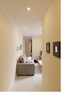 a living room with a couch and a table at For You Rentals parque del retiro apartment TEMPORAL LDR28 in Madrid