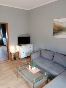 a living room with a couch and a coffee table at Flensburg City 6 1 in Flensburg