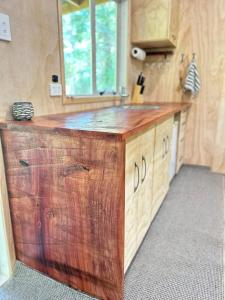 a kitchen with a wooden counter top in a room at Secluded Redwood Cabin in Ashley Clinton