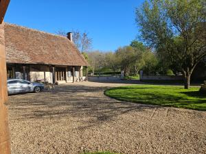 a house with a car parked in the driveway at Nid de Coucou in Cernoy-en-Berry +61 photos