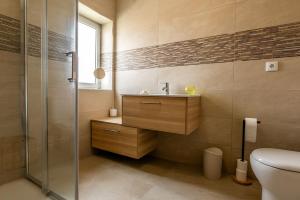 a bathroom with a sink and a shower at Mirador House in Vila Garcia +11 photos