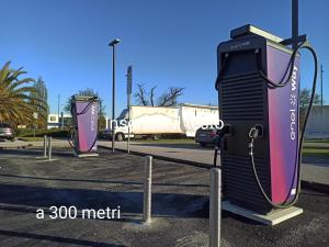a rendering of a gas station in a parking lot at B&B Casa Fuori Casa - 200 mt dal casello autostradale, parcheggio gratuito, garage moto in Senigallia +27 photos