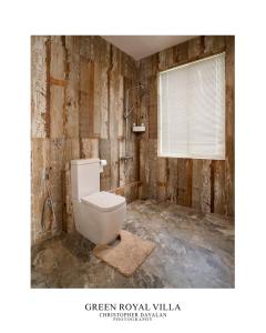 a bathroom with a white toilet in a room at Green Royal Villa in Kandy +21 photos