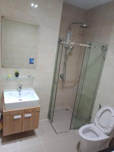 a bathroom with a shower and a toilet and a sink at เพียร์93 in Ban Pak Khlong Si +2 photos
