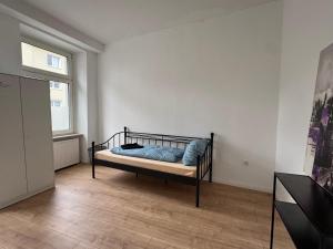 a bedroom with a bed with blue pillows on it at Platin Appartement in Wuppertal