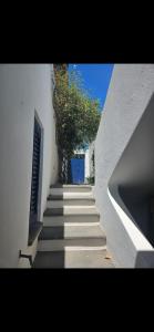 a stairway with stairs leading up to a building at A casa di Ale in Stromboli