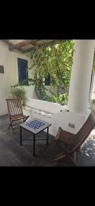 two chairs and a coffee table on a patio at A casa di Ale in Stromboli