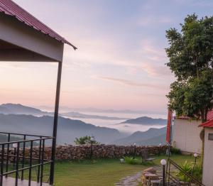 a view of the mountains from a house at 7 Hills Resort Kanatal in Kanatal