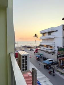 a view of the beach from a balcony of a building at Bambus Motel in Jomtien Beach