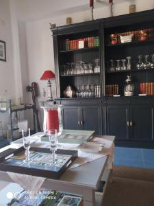 a dining room table with glasses on top of it at Villa Thierry in Leiria
