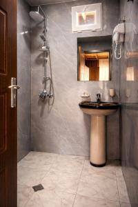 a bathroom with a sink and a mirror at Martvili canyon cottage in Martvili +96 photos