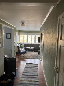 a living room with a couch and a table at Fjærestua in Hitra