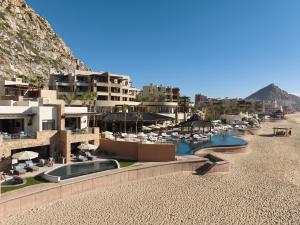arial view of a resort with a beach and buildings at Waldorf Astoria Los Cabos Pedregal in Cabo San Lucas