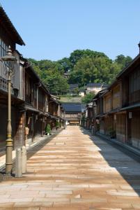 an empty street in an old town with buildings at Stacy Annex in Kanazawa
