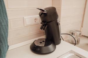 a black mixer sitting on top of a counter at Brockmann, Ferienidylle in Neuenkirchen