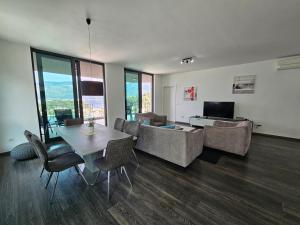 a living room with a couch and a table at Korcula Holiday in Korčula