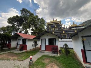 a building with a pagoda on top of it at Dakshinkali & Dollu Resort in Pharping