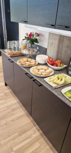 a kitchen with many plates of food on a counter at Place Lund in Lund