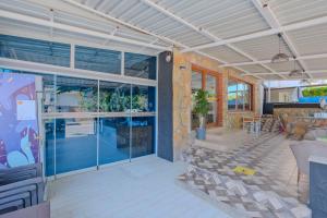 a living room with glass doors and a patio at Otel DENİZYILDIZI CENTRUM in Fethiye